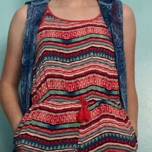 A Multi-Colored Romper with a long Vest